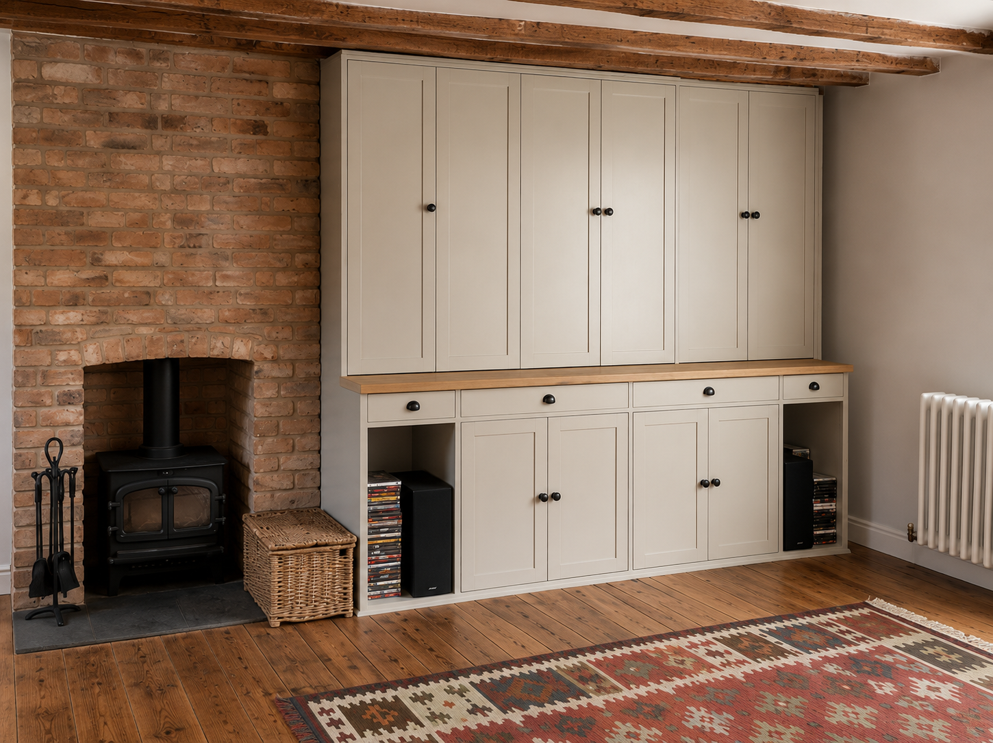 Deep blue bespoke library cabinetry with integrated window seat